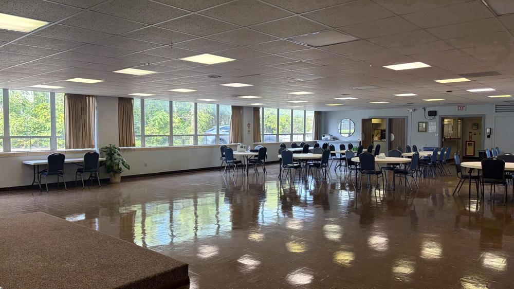 A wide open area of the CORE Foundations activity room with natural light from a long bank of windows